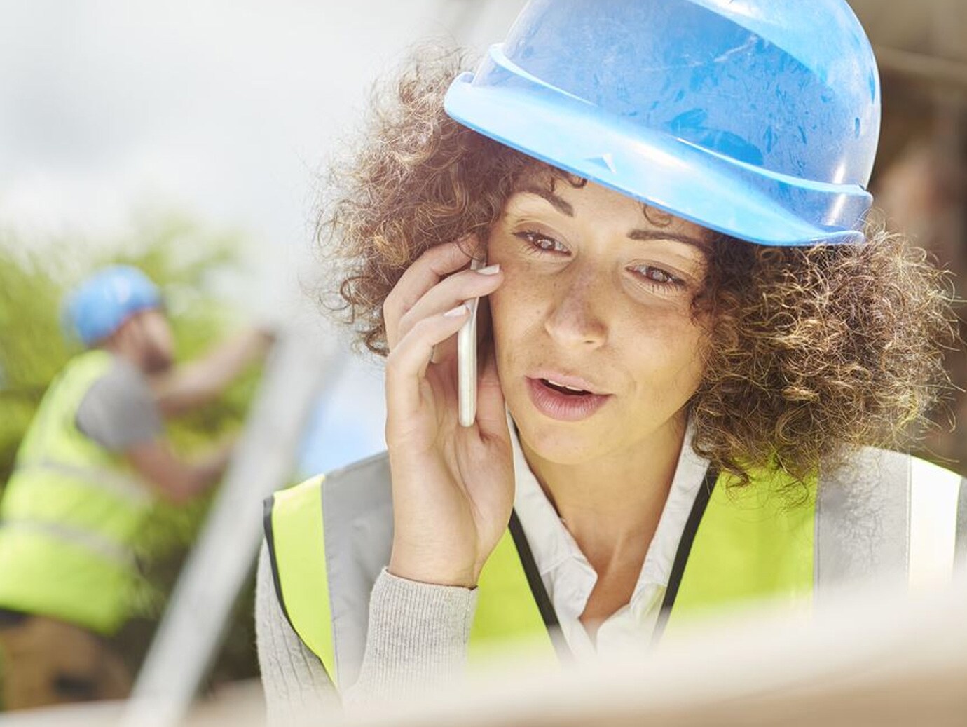 construction worker talking on phone