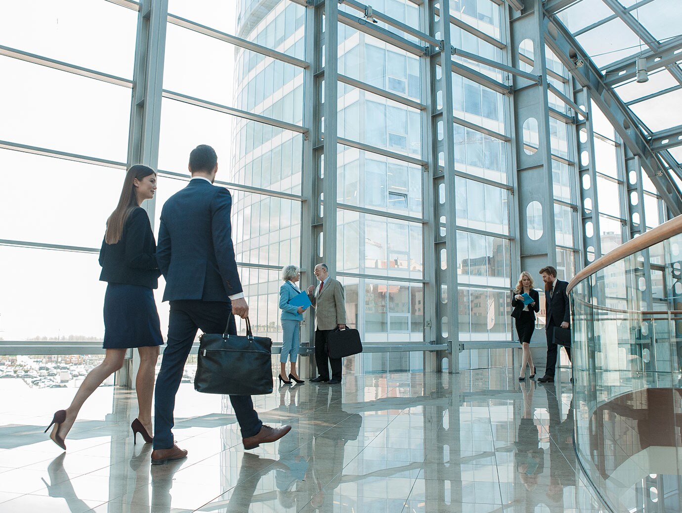 Businesspeople walking in modern office space