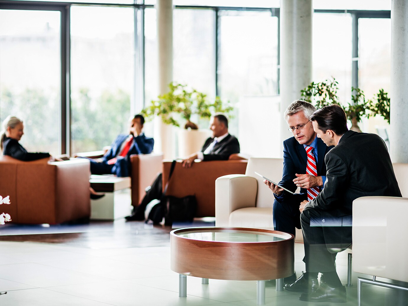 people discussing in lounge