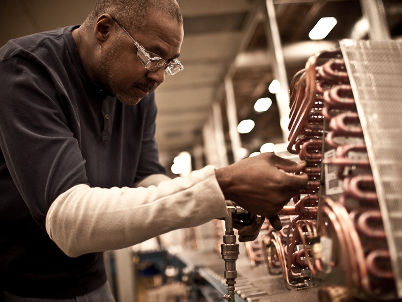 Industry worker working on a machine 