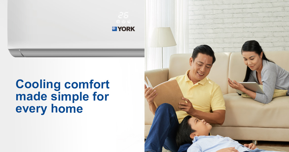 A happy family reading together on the couch